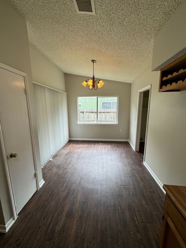 Building Photo - NICE 3 BEDROOM FEATURING WOOD VINYL PLANK ...