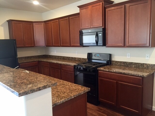 Large kitchen with ample cabinetry and counter space! - 1517 Sepia Ave
