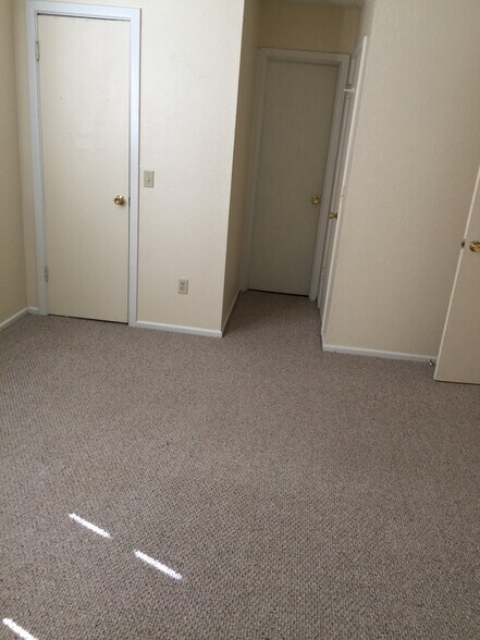 master bedroom showing 2 closets and entry to master bath - 4123 Villa Dr