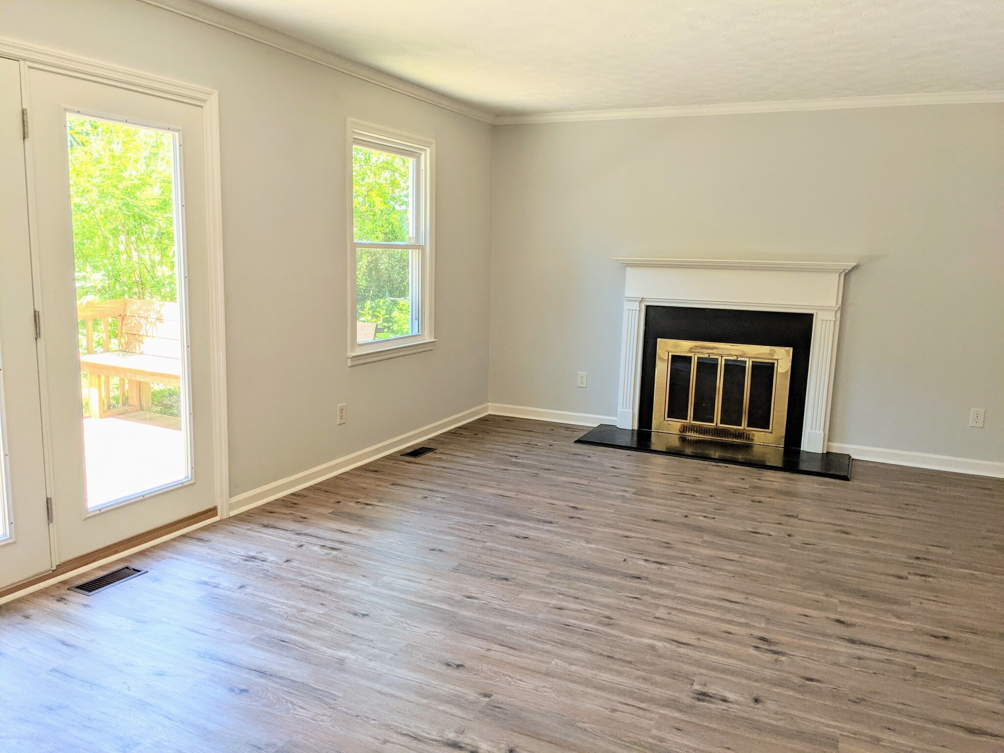 Living room with decorative fireplace focal point - 3221 Hunters Point Dr