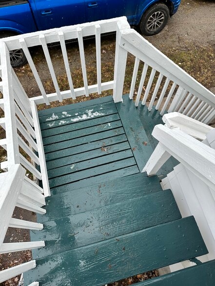 Stairs to upper unit. They do have slip tape on them as well (after pic was taken) - 606 W 5th St