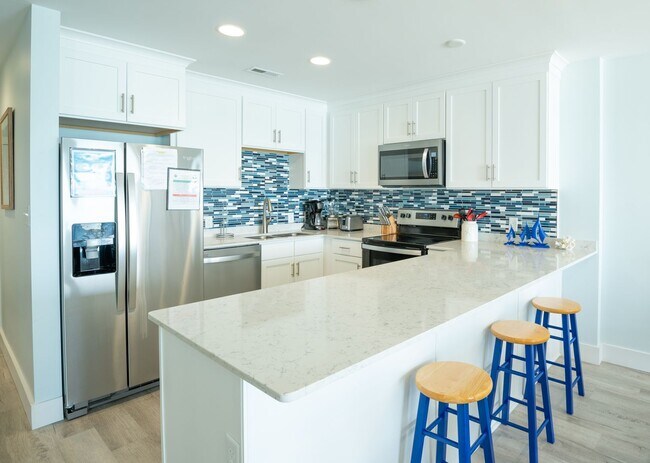 Building Photo - SPEND YOUR OFF-SEASON AT THIS TOP FLOOR OCEANFRONT CONDO