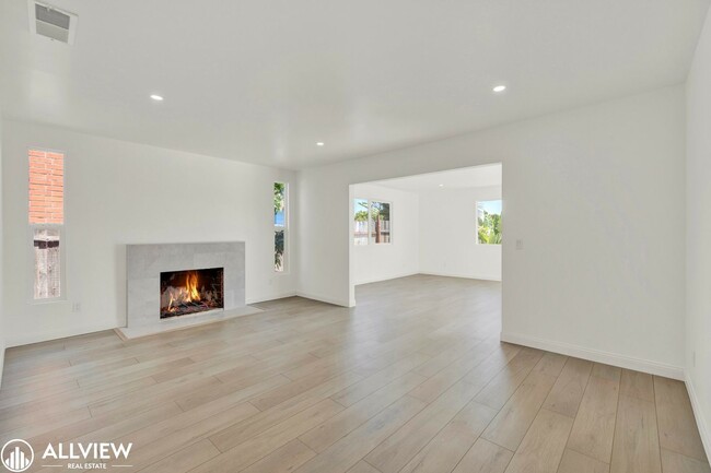 Building Photo - Fully Renovated 4-Bedroom Home with Firepl...