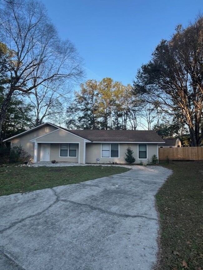 Building Photo - 3/2  home fenced in backyard located acros...