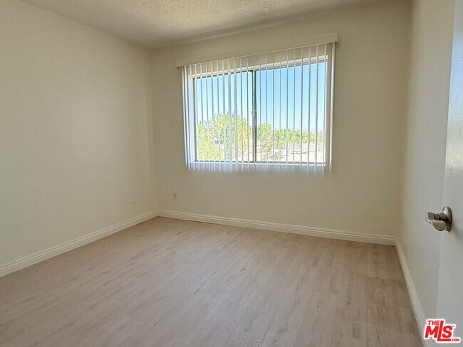 Building Photo - 10200 De Soto Ave