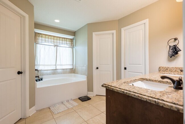 Building Photo - POOL - Elegant 4-Bedroom Home with Fenced Yard