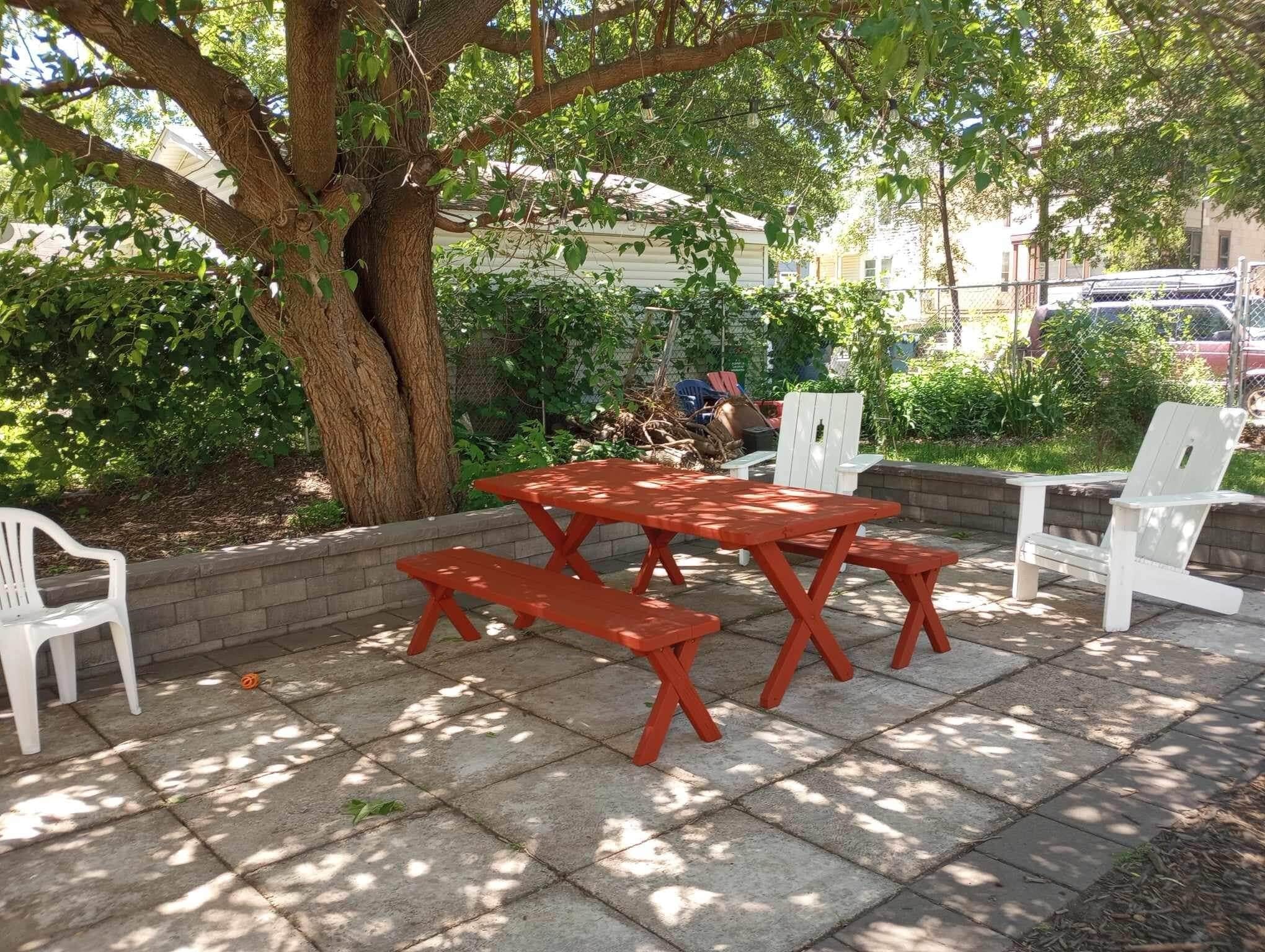 Patio and firepit in huge fenced in yard. - 2320 Monroe St NE