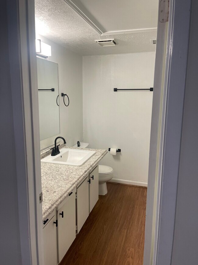 Renovated bathroom with in unit washer and dryer - 4441 Old College Rd