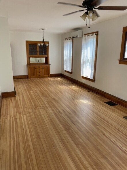 Main room with refinished floors and new paint - 2918 N Gaylord St