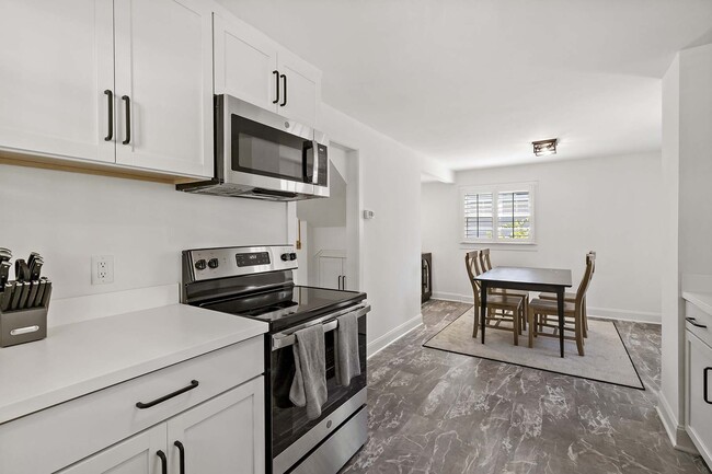 Kitchen includes an informal dining area - 129 Chicago Ave N