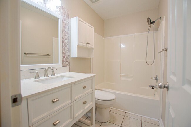 Building Photo - Pet Friendly Three Bedroom with Bonus!