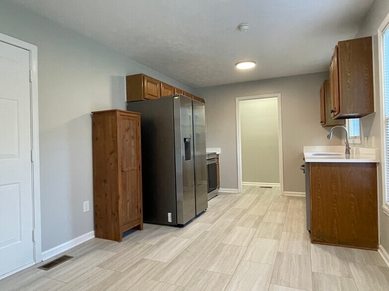 Kitchen with new LV tile - 10521 Cornell Ave