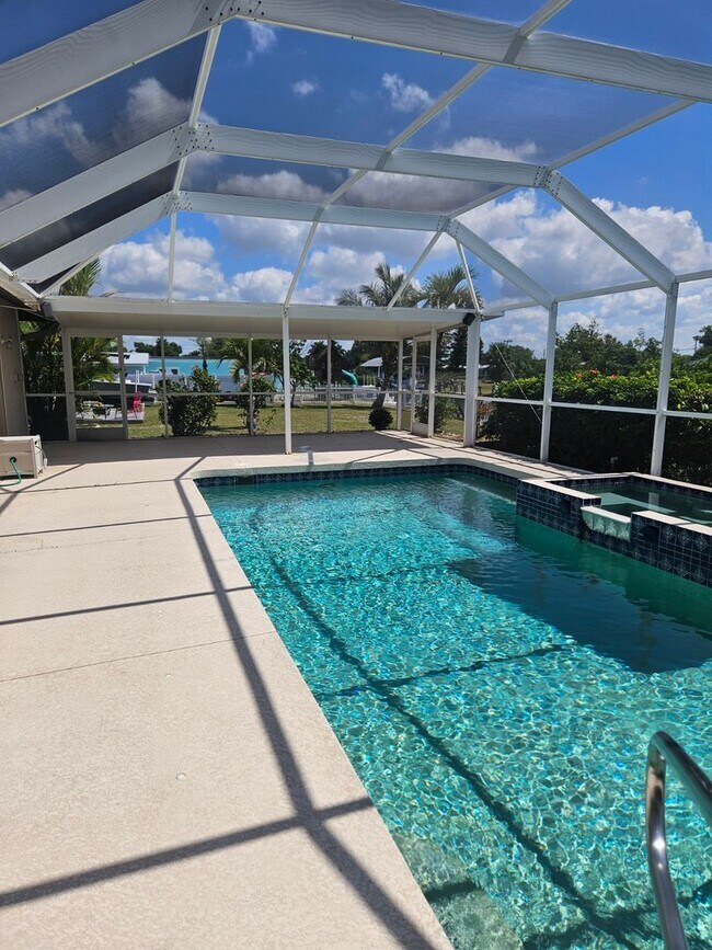 Building Photo - Port Charlotte Waterfront salt water pool annual rental