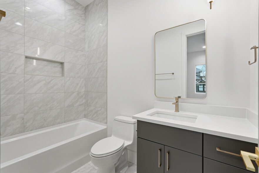Modern bathroom featuring clean finishes, sleek fixtures, and a bright, refreshed feel - 3718 West End Ave
