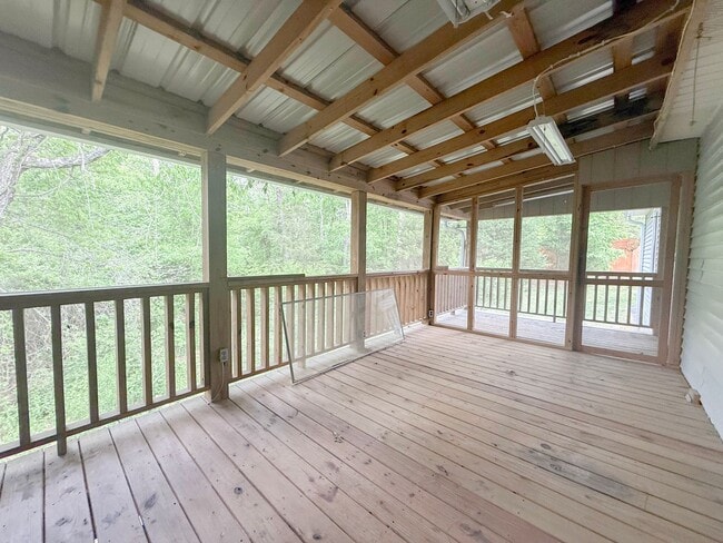 Building Photo - Spacious 3-Bedroom Home with Screened Porch, 2-Car Garage + Workshop