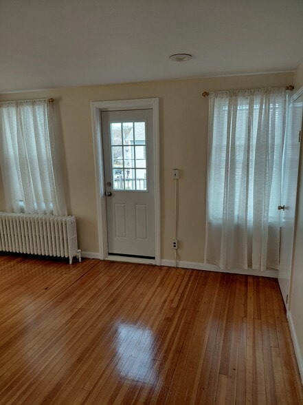 Living room w/door going out to porch - 41 Saratoga Ave