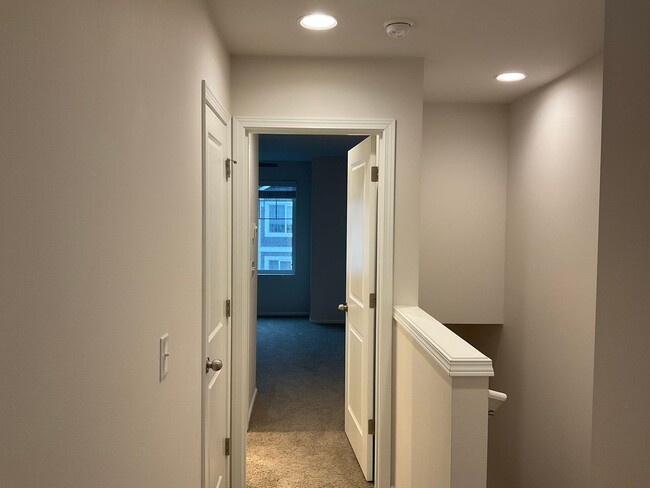 Building Photo - Riverfront Townhome with Tandem Garage & Fenced Yard