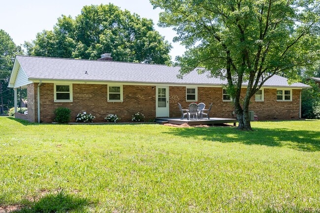 Building Photo - Classic brick rancher with carport and updated decor