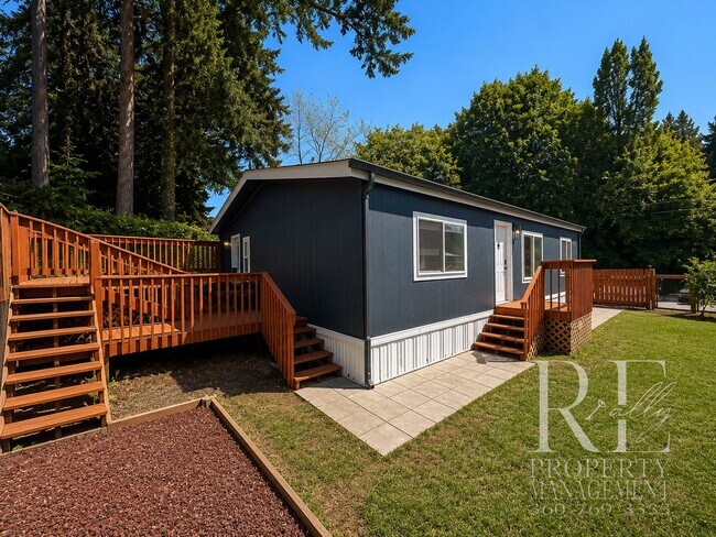 Building Photo - Walk to the Ferry from This Updated Port Orchard Home with Expansive Deck & Gated Yard