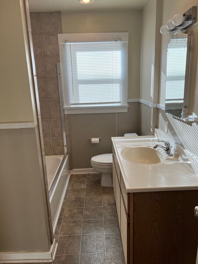 Building Photo - Fenced Yard - Laminate Flooring - Mid-Town - Extra Outside Storage