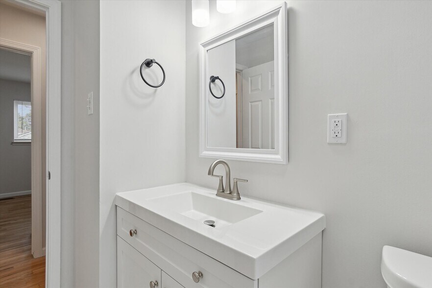 Newly remodeled main floor bathroom with under sink storage. - 9244 Northern Ave