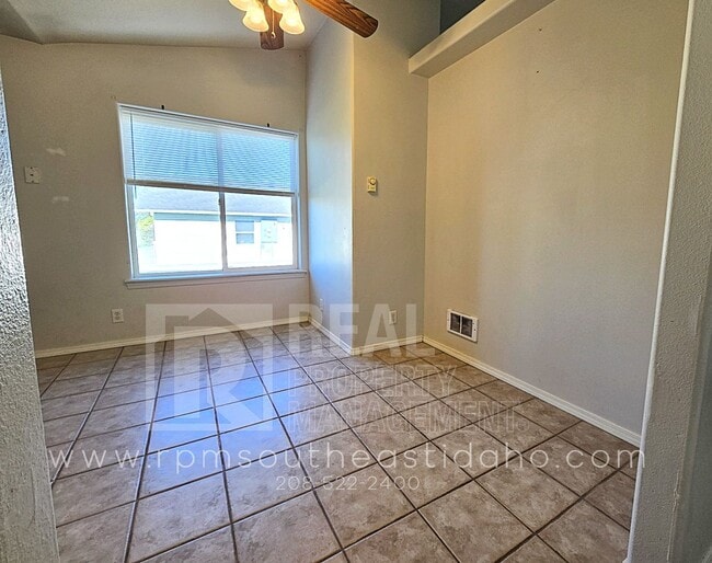Building Photo - Spacious & Updated 2 Bedroom, 2 Bathroom Twin Home in Ammon with Garage, Fenced Backyard, and Hoo...