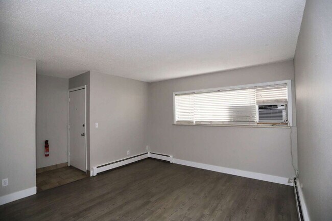 Building Photo - Updated & Clean 2BR Condo - Utilities Included - Laundry, Parking & Pool