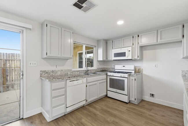 Building Photo - $1,000 Off First Month's Rent | 3-Bedroom Home with Detached 2-Car Garage, Fireplace & Private Patio