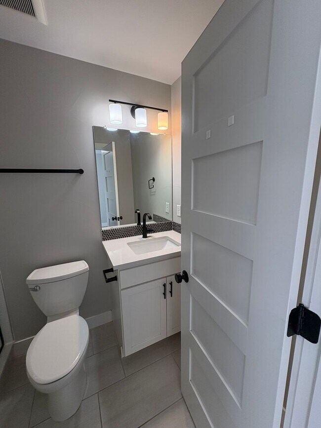 Building Photo - Modern 2 Bed + Flex Townhome with Rooftop Deck Near Paco Sanchez Park & Light Rail