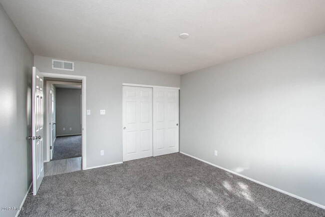 Building Photo - COMPLETELY REMODELED 4 BEDROOM, 2 BATH TEM...