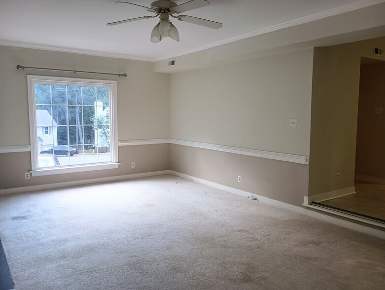 Large window with lots of sunlight in family room - 5505 Standing Oak Pl