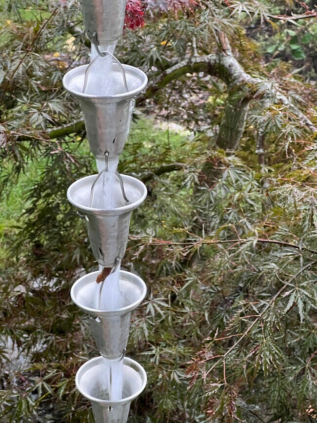 Rain chains add accent to the home. - 73 Swannanoa Ave