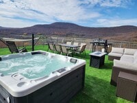 Building Photo - Modern Mountain Retreat with Rooftop Hot T...