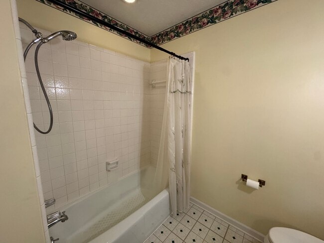 Building Photo - Spacious three bedroom, two bathroom with covered back porch and detached garage located on Cave ...