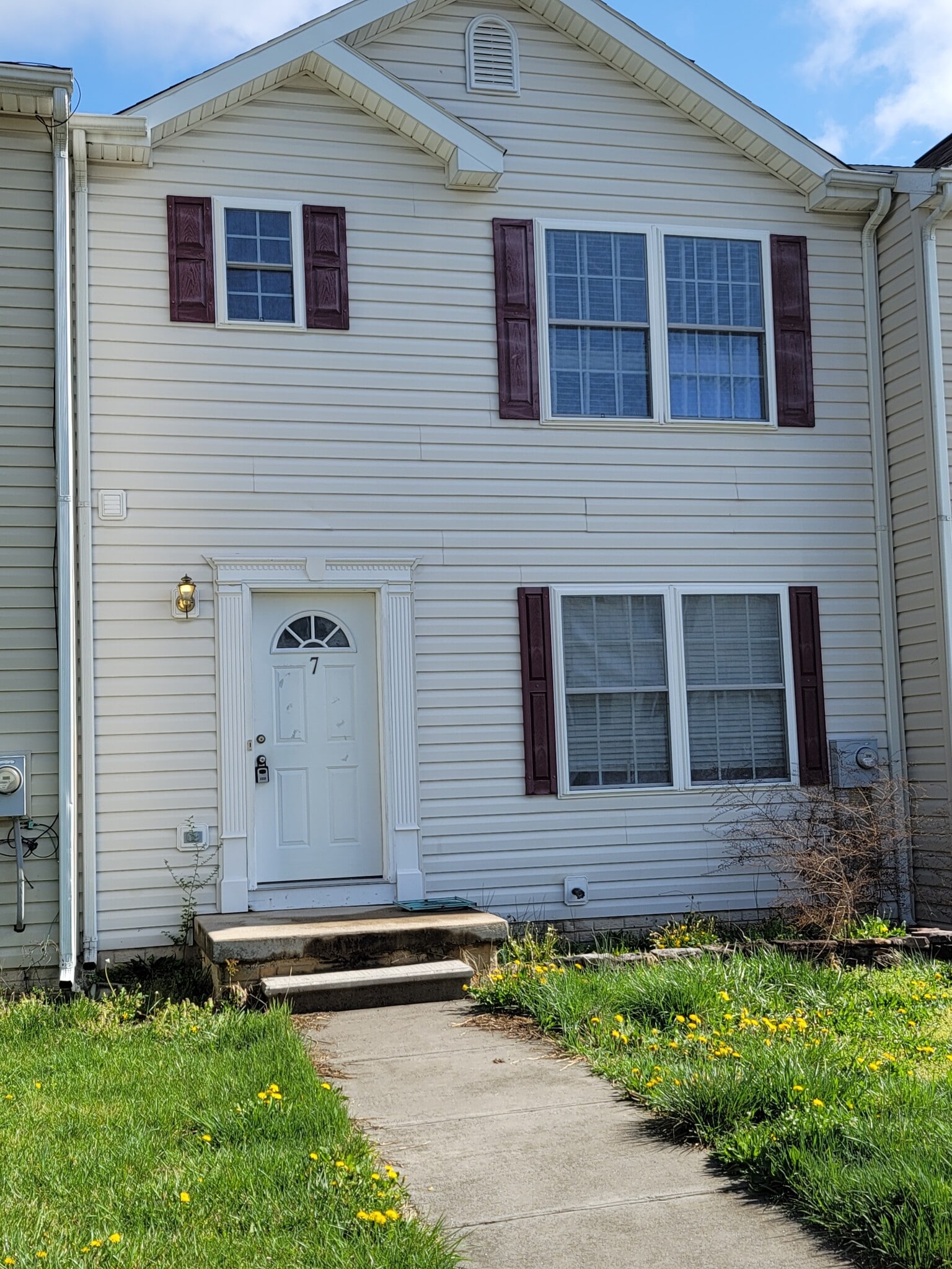 Front exterior with reserved parking - 7 Lotus Dr