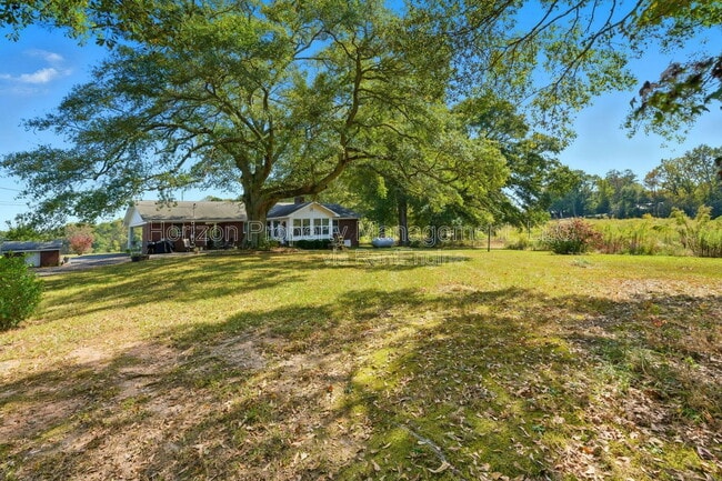 Building Photo - 8730 Jot Em Down Rd