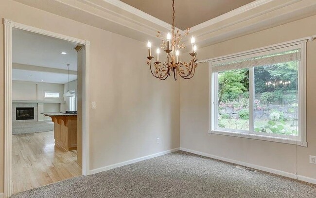 Building Photo - Spacious Four-Bedroom Home with Gourmet Kitchen, Multiple Living Areas, Loft, and Beautifully Lan...
