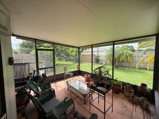 Building Photo - Well maintained 2/2 with a large yard in a...