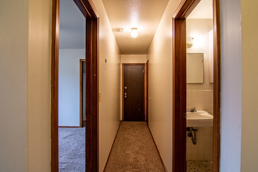 back door, bedroom, and bathroom from hallway - 117 Mississippi Pl