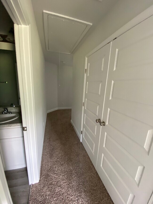 Upstairs hall with linen closet and pull down attic access - 78 Horizon Ln