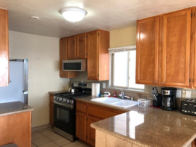 Beautiful kitchen in granite, wood, and stainless steel - 3261 Ocean Front Walk