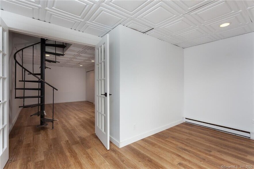 Second room with full glass slider window to patio separated by French doors - 188 Flax Hill Rd