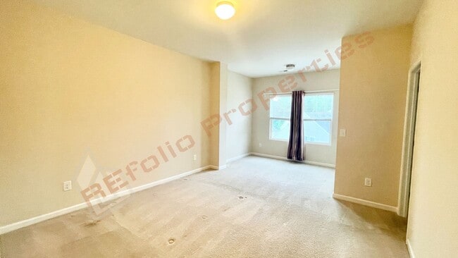 Building Photo - 3 Story Townhome 3 Bedrooms Rear Entry 2 Car Attached Garage with 1st Floor Bedroom, Community Po...