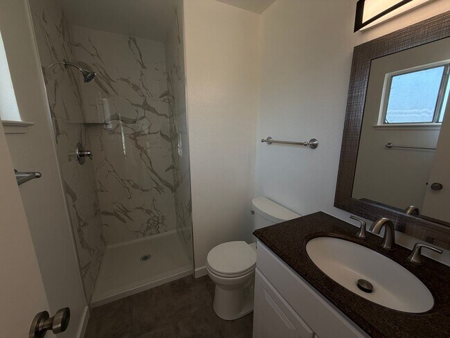 Building Photo - Recently updated home with new floors, paint & bathroom!