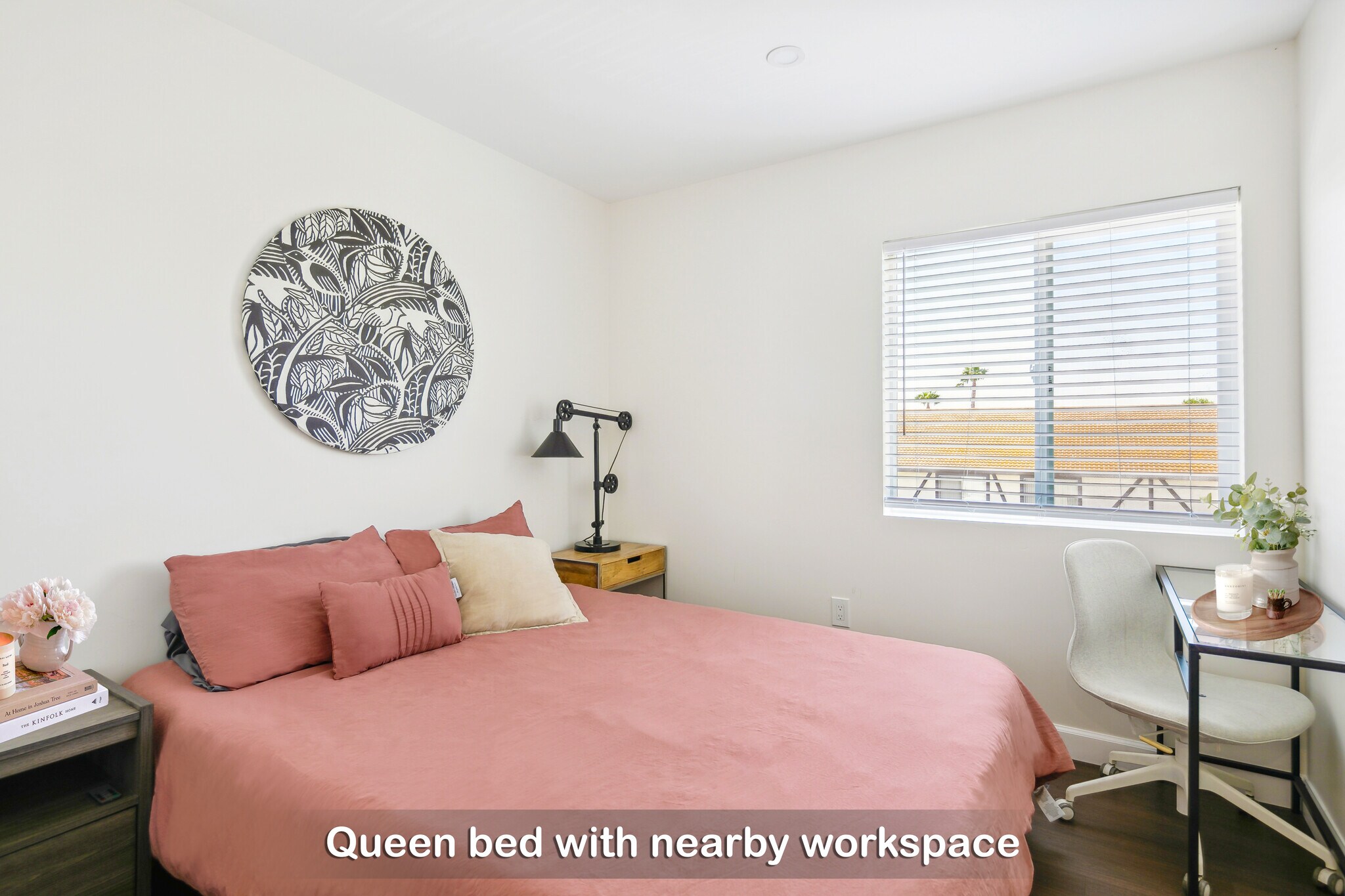 Unwind in this cloud-like queen bed, complete with a nearby workspace for productivity in Bedroom 2. - 721 E 22nd St