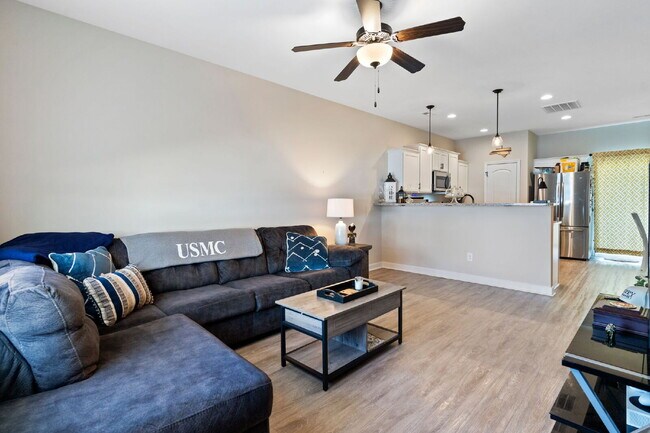 Building Photo - Available Now! Enjoy low-maintenance coastal living in this beautiful 2-bedroom, 2.5-bath townhom...