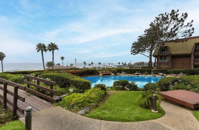 Building Photo - "Chic Beachside Living: 1-Bedroom Retreat ...