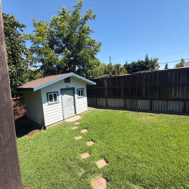Building Photo - Adorable house with large deck,  yard and RV access