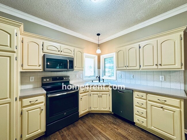 Building Photo - Blue Valley Schools w/ Wood Floors, Finished Basement and a Peaceful, Private Fenced Yard!