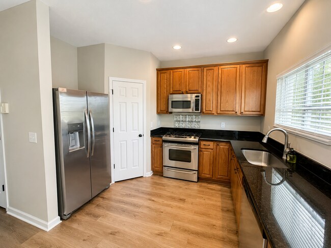 Building Photo - Beautiful 3-Bedroom Townhome with Pond View | Lawn Care Included | Convenient Whitsett Location